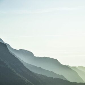 Mountain Landscapes - A serene view of misty mountain layers in Schwaz #1054222