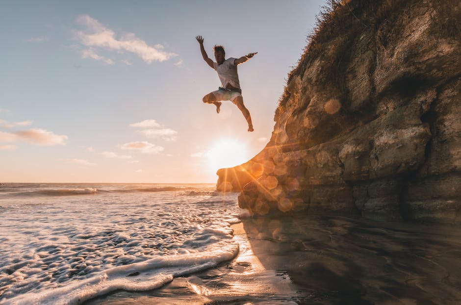 Beach Scenery - A man jumps off a cliff at sunset in Encinitas, #1168742