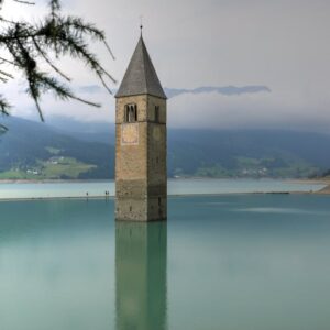 Lake Reflections - Captivating view of the bell tower in Lake Resch #11800586