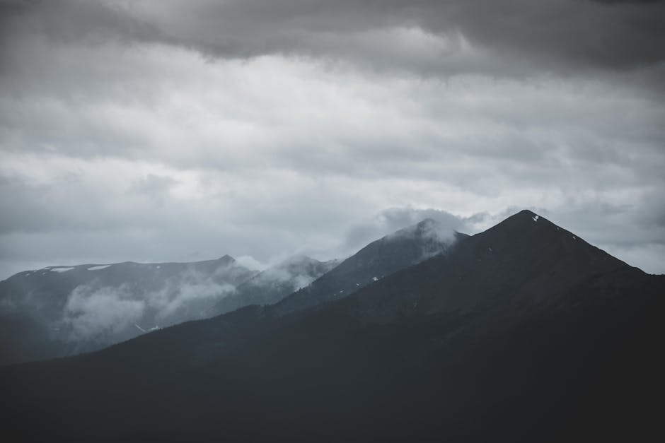 Mountain Landscapes - A moody mountain landscape shrouded in clouds an #1363873