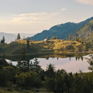 Mountain Landscapes - Tranquil mountain lake surrounded by lush forest #18062747