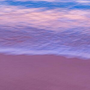 Beach Scenery - Gentle ocean waves on a serene beach at sunset c #2236703