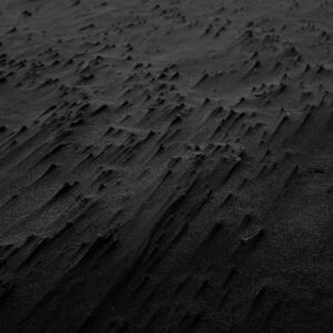 Desert Wilderness - Abstract black sand texture creating a dramatic  #2387819