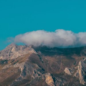 Mountain Landscapes - Stunning view of a mountain peak with clouds ove #2716298