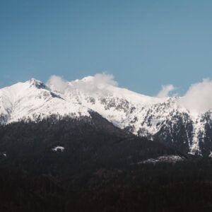 Mountain Landscapes - A scenic view of snow-covered mountain peaks und #31940796