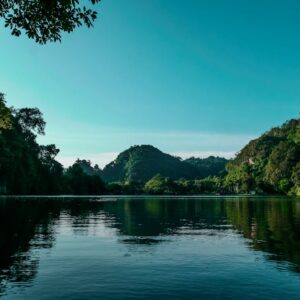 Lake Reflections - Tranquil lake surrounded by lush green mountains #33268