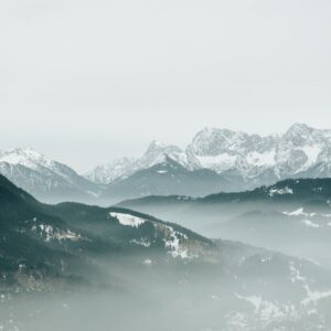 Mountain Landscapes - Serene view of a misty, snow-covered alpine moun #35898951