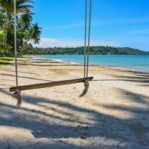 Beach Scenery - Enjoy a serene view of a sandy beach with a swin #36148838