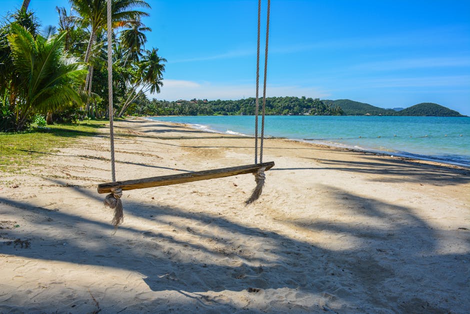 Beach Scenery - Enjoy a serene view of a sandy beach with a swin #36148838