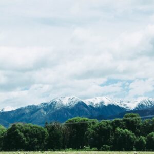 Snow Mountains - Majestic snow-capped mountains under a cloudy sk #4053563