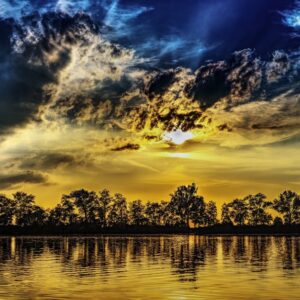 Lake Reflections - Stunning sunset reflecting on a lake with silhou #461941