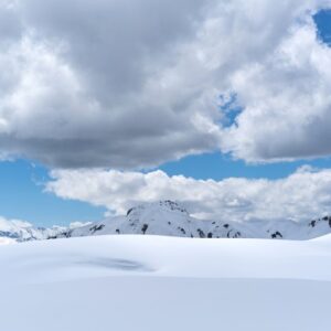 Snow Mountains - Majestic snowy mountains under a cloud-filled sk #4638019