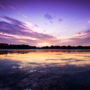 Lake Reflections - Serene landscape of a tranquil sunset reflecting #4991338