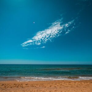 Beach Scenery - While stratus cloud in bright blue sky over endl #5592632