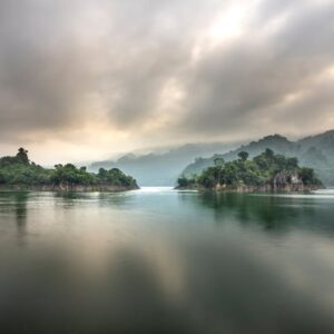 Lake Reflections - Rocky islands under tropical woods in pond surro #6136296