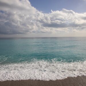 Beach Scenery - A tranquil seascape with gentle waves, white clo #6189856