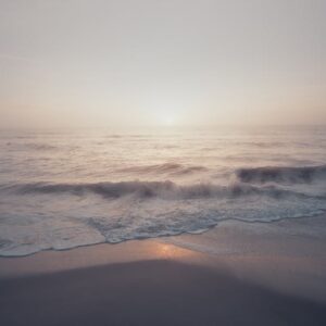 Beach Scenery - Peaceful ocean waves and soft sunrise light at M #7575604