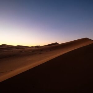 Desert Wilderness - Breathtaking view of sand dunes under a colorful #998631